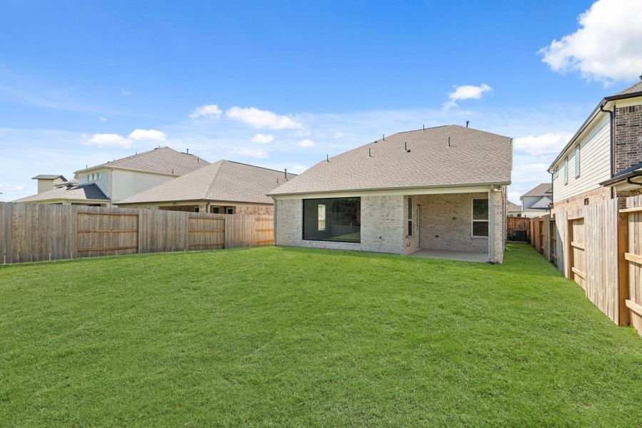 Exterior details and patio area of a home in Sunterra, Katy (Image 14).