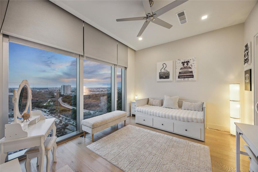 Secondary bedroom with remote solar and blackout shade.