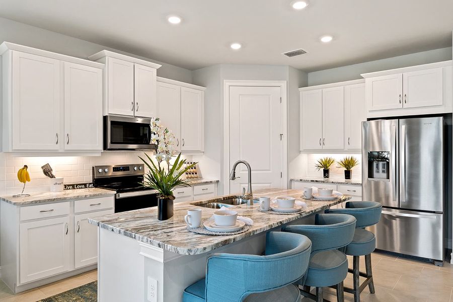 Representative furnished interior of a home built from the Delray by D.R. Horton in Coral Bay - Express & Tradition, North Fort Myers (Image 5).