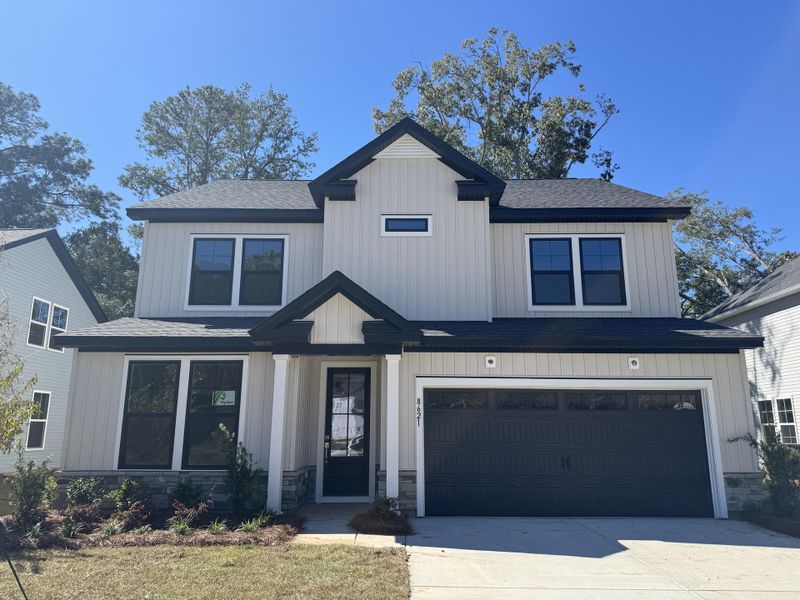 Front exterior of a new home in , North Charleston, SC, highlighting curb appeal (Image 1). Front exterior of a new home in , North Charleston, SC, highlighting curb appeal (Image 1).