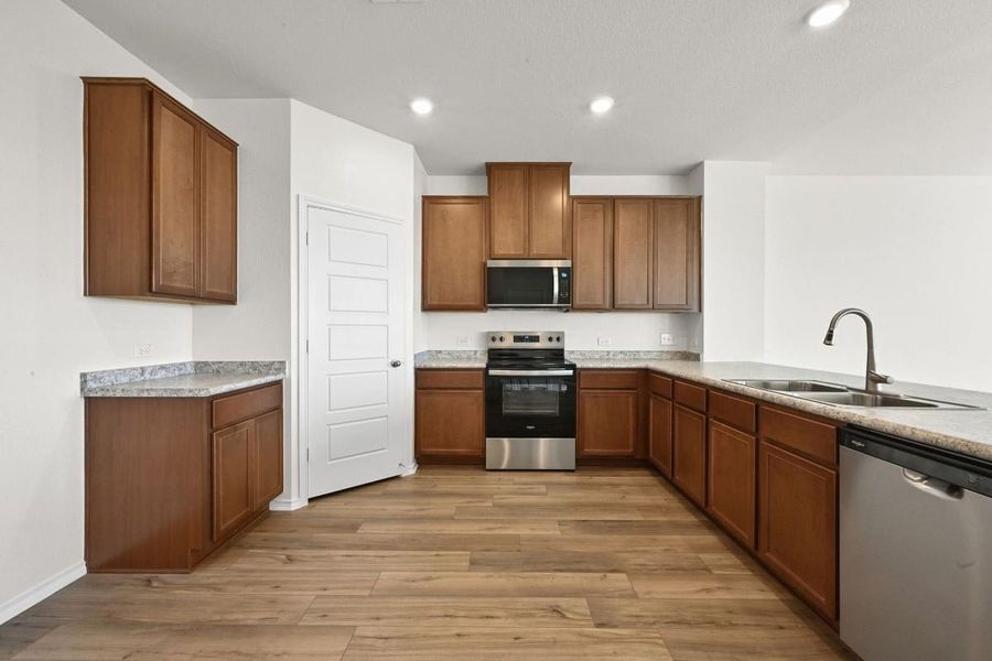Furnished interior view inside a new home in Stoney Chase, Del Valle (Image 5).