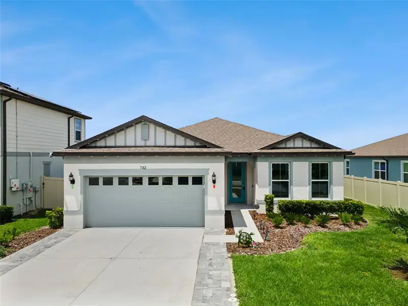 Front exterior of a new home in , Lake Alfred, FL, highlighting curb appeal (Image 25).