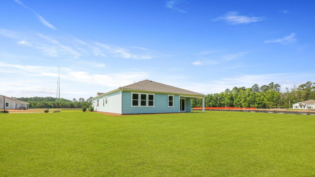 Front exterior of a new home in Berkeley Bay, Ridgeville, SC, highlighting curb appeal (Image 1).