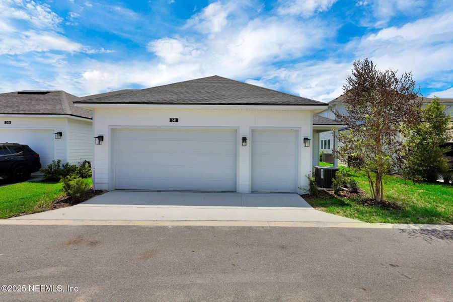 Front exterior of a new home in Seabrook Village at Seabrook, Ponte Vedra, FL, highlighting curb appeal (Image 22).