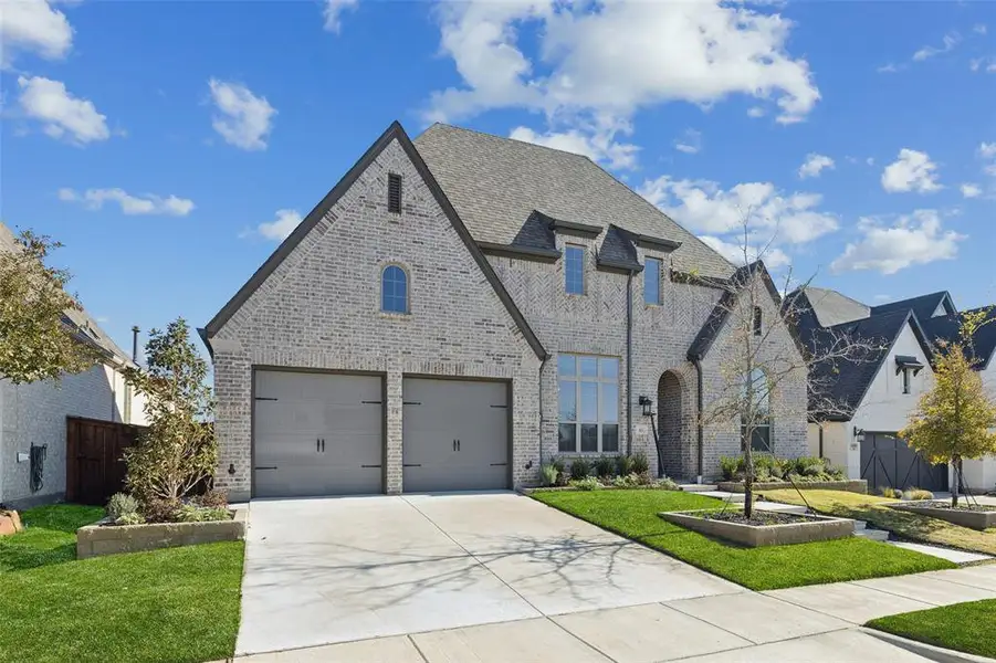 Front exterior of a new home in , Aubrey, TX, highlighting curb appeal (Image 2).