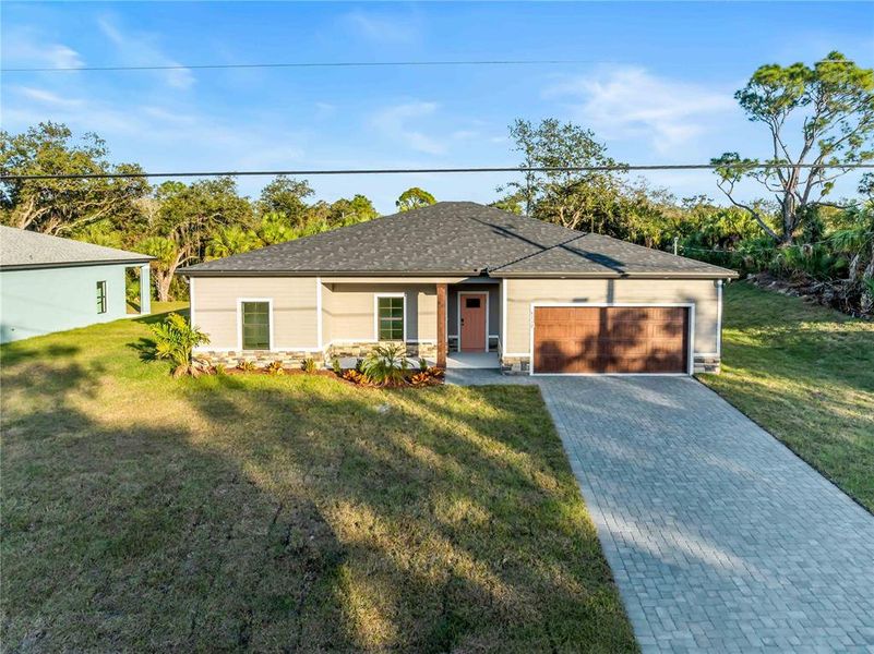 Front exterior of a new home in , North Port, FL, highlighting curb appeal (Image 25).