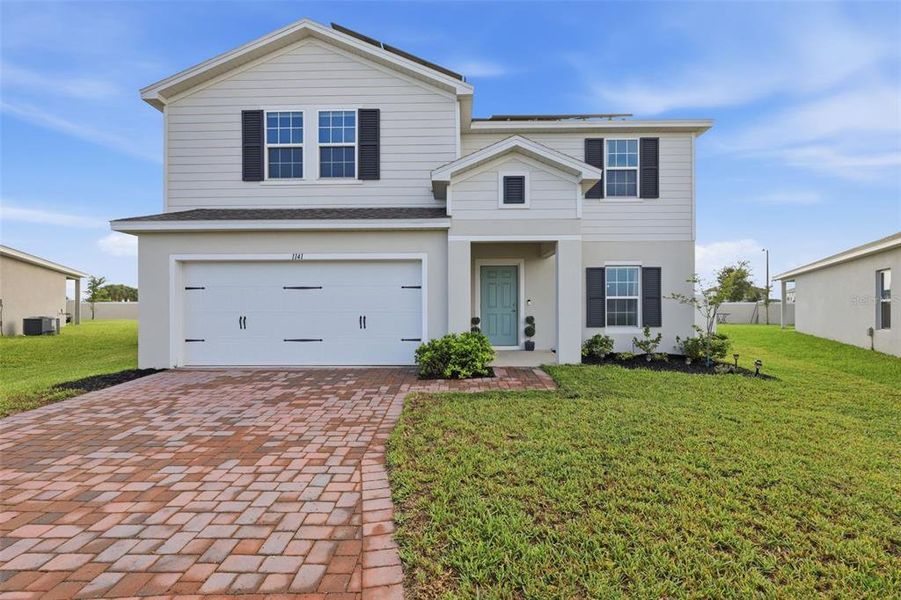 Front exterior of a new home in , Haines City, FL, highlighting curb appeal (Image 26). Front exterior of a new home in , Haines City, FL, highlighting curb appeal (Image 26).