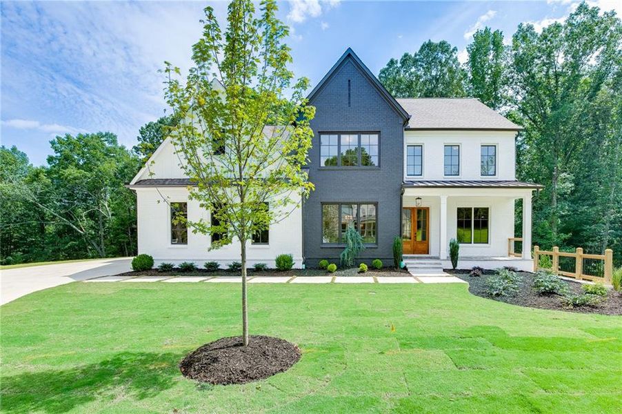 Front exterior of a new home in , Buford, GA, highlighting curb appeal (Image 32).