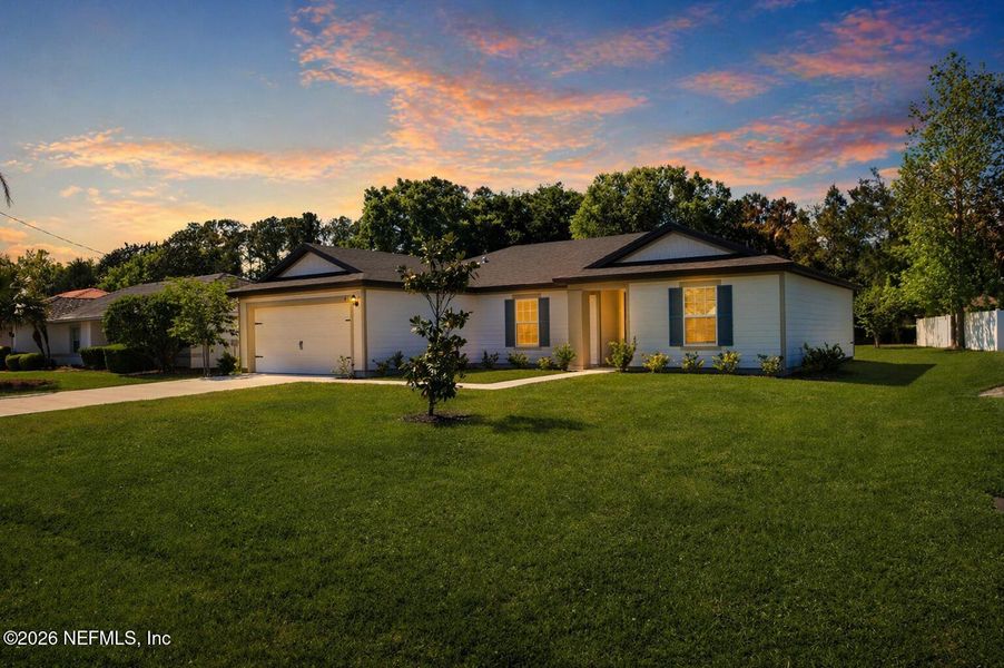 Front exterior of a new home in Palm Coast, Palm Coast, FL, highlighting curb appeal (Image 14). Front exterior of a new home in Palm Coast, Palm Coast, FL, highlighting curb appeal (Image 14).