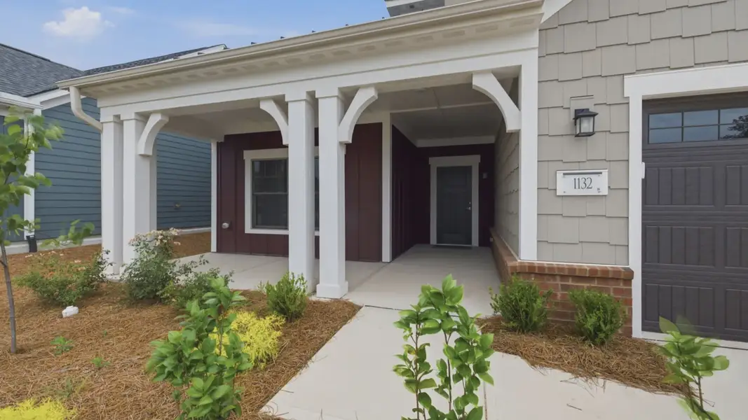 Exterior details and patio area of a home in The Courtyards at Oak Grove, Durham (Image 3).