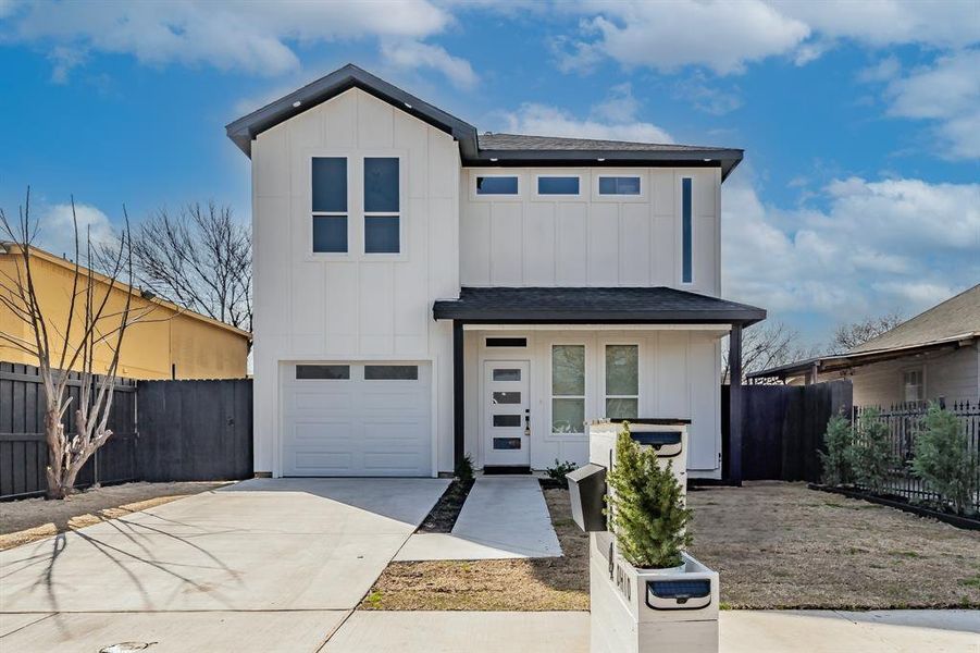 View of front of property featuring a garage