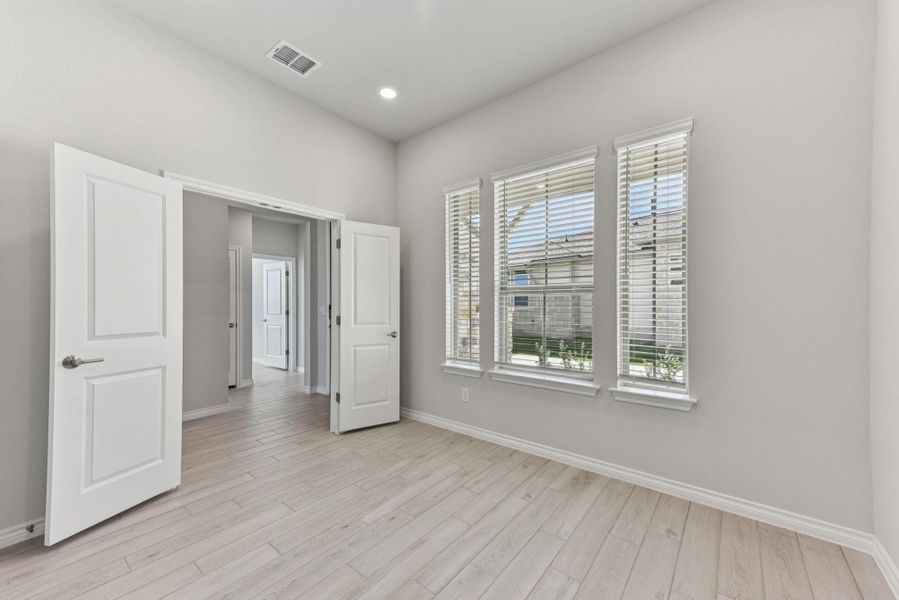 Unfurnished bedroom featuring light wood-style flooring and recessed lighting Unfurnished bedroom featuring light wood-style flooring and recessed lighting