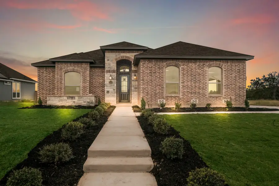 Representative exterior photo of a completed home built from the The Brighton by Whitestone Custom Homes in Johnson Ranch, Bulverde, TX (Image 1). Representative exterior photo of a completed home built from the The Brighton by Whitestone Custom Homes in Johnson Ranch, Bulverde, TX (Image 1).