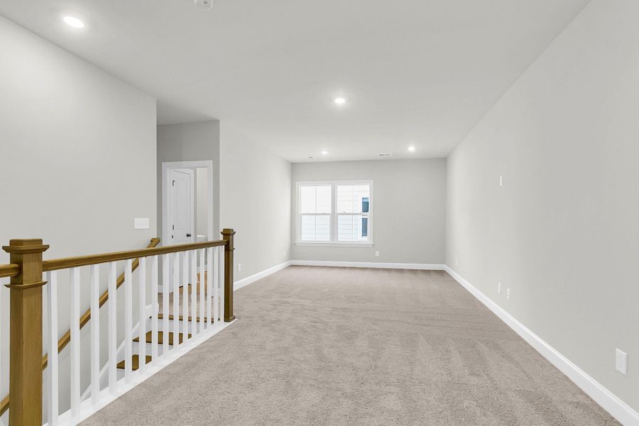 Spacious, unfurnished interior of a new home in Tidewater at Lakes of Cane Bay, Summerville (Image 39).