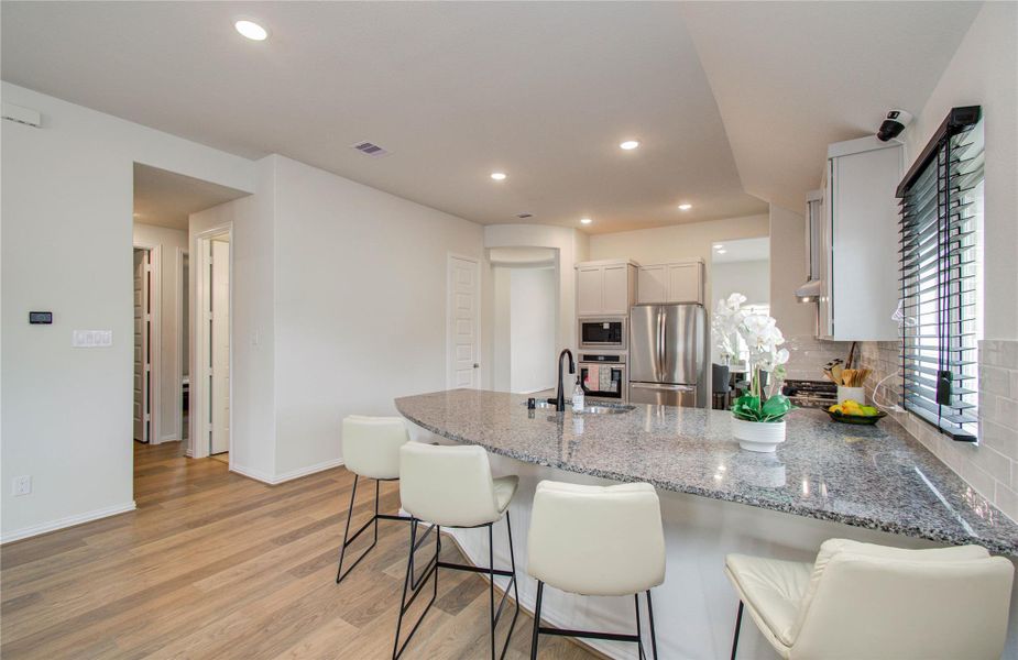 Furnished interior view inside a new home in Sunterra, Katy (Image 24).