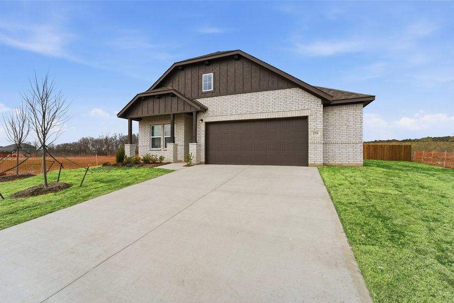 Front exterior of a new home in Saddlebrook Estates, Waxahachie, TX, highlighting curb appeal (Image 25).
