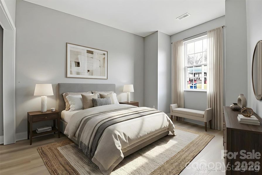 Walking into the second bedroom on the second floor (virtually staged/enhanced).