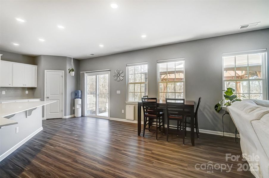 Open Layout of Gourmet Kitchen, Breakfast area, & Living Room