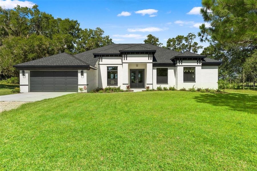 Front exterior of a new home in , Lecanto, FL, highlighting curb appeal (Image 27).