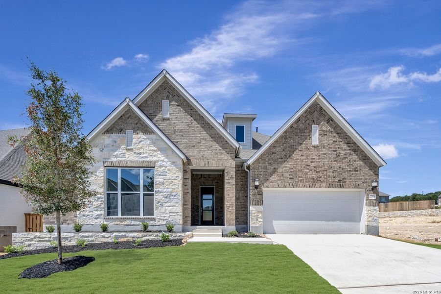 Front exterior of a new home in Windsong - Legacy Series, Boerne, TX, highlighting curb appeal (Image 27). Front exterior of a new home in Windsong - Legacy Series, Boerne, TX, highlighting curb appeal (Image 27).