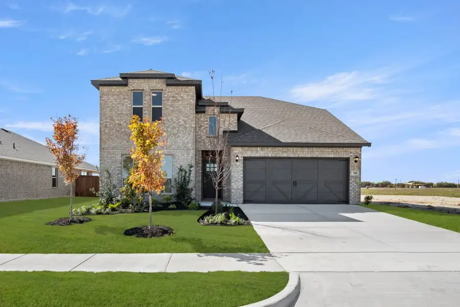 Front exterior of a new home in Myrtle Creek, Waxahachie, TX, highlighting curb appeal (Image 1). Front exterior of a new home in Myrtle Creek, Waxahachie, TX, highlighting curb appeal (Image 1).