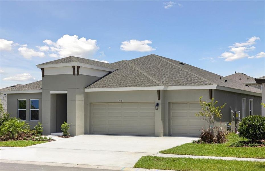 Front exterior of a new home in Waterset, Apollo Beach, FL, highlighting curb appeal (Image 16).