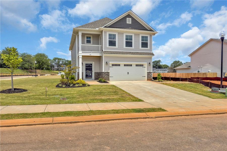 Front exterior of a new home in Brownstone Park, Easley, SC, highlighting curb appeal (Image 2).