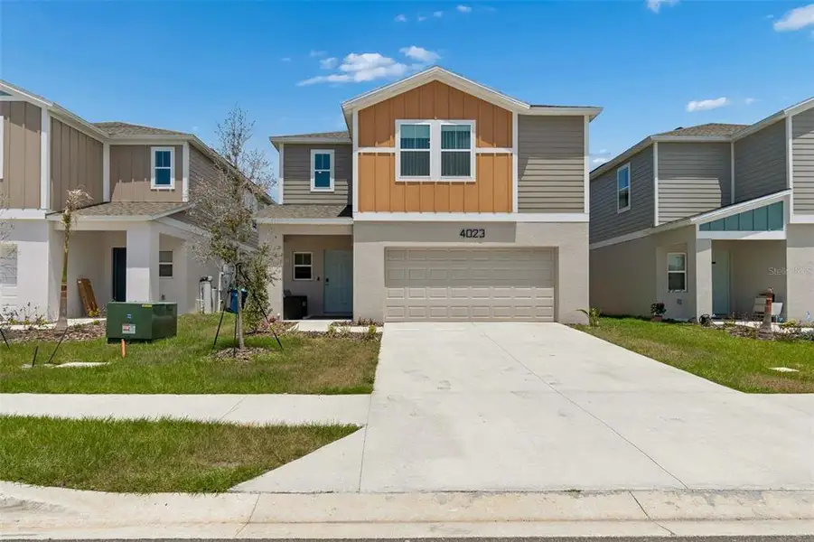 Front exterior of a new home in , Haines City, FL, highlighting curb appeal (Image 27).