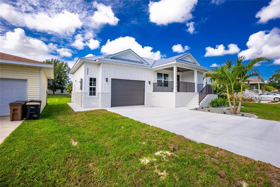 Front exterior of a new home in , Punta Gorda, FL, highlighting curb appeal (Image 25).