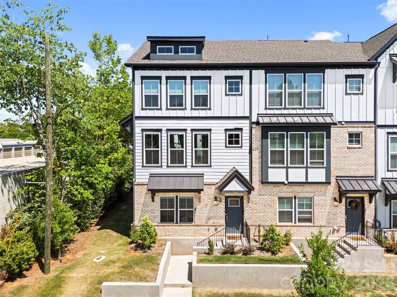 Front exterior of a new home in Parkside Commons, Davidson, NC, highlighting curb appeal (Image 2).