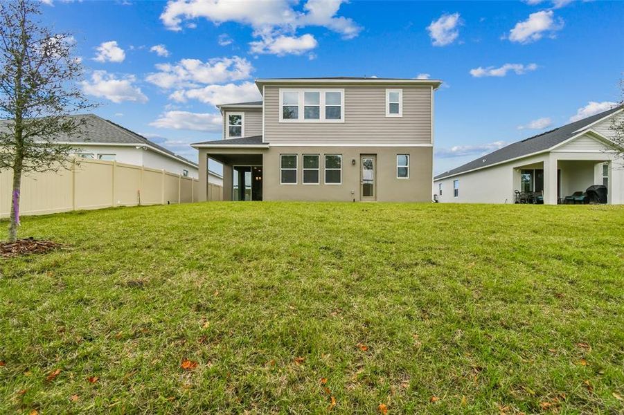 Exterior details and patio area of a home in Emerson Pointe, Apopka (Image 4).
