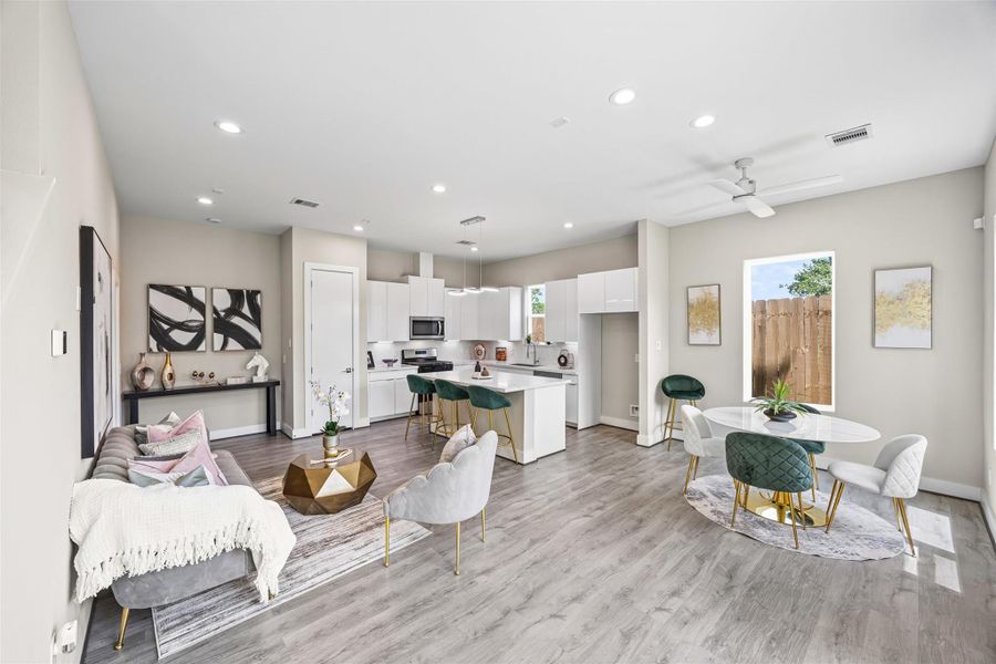 This open floor plan seamlessly connects the living, dining, and kitchen areas, creating an inviting space perfect for entertaining. This open floor plan seamlessly connects the living, dining, and kitchen areas, creating an inviting space perfect for entertaining.