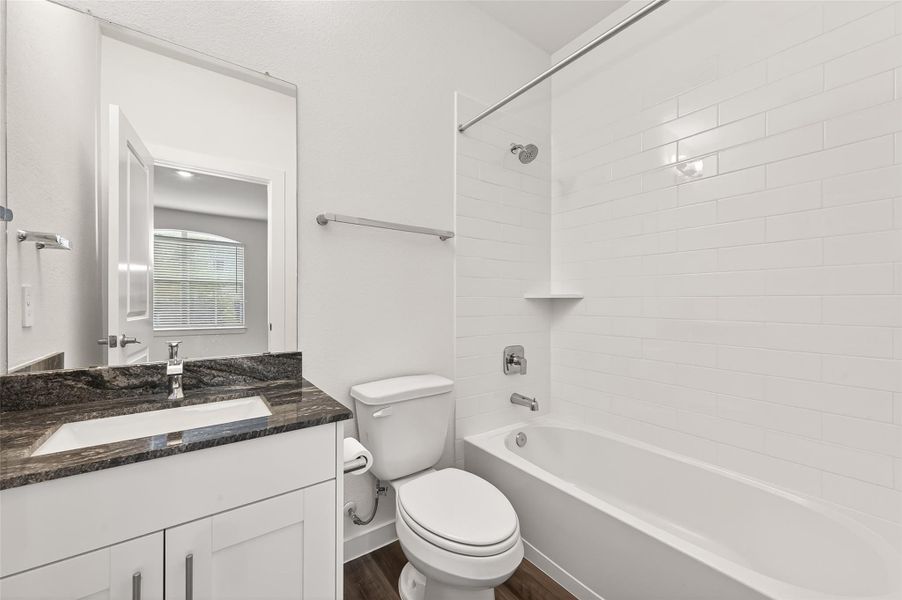 Guest Private Full bath: Beautiful countertops, tub/shower with subway tiles.