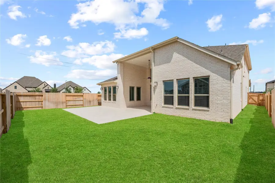 Enjoy the peace of this fully fenced backyard, offering an expansive lawn with plenty of space for outdoor recreation and relaxation.