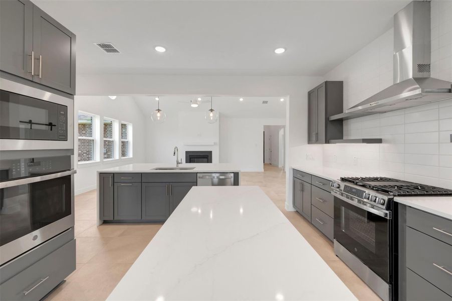 Stylish kitchen with grey cabinets and 2 islands
