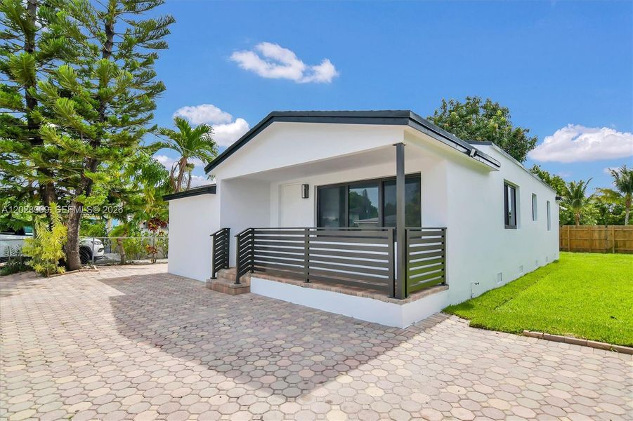 Exterior details and patio area of a home in , Miami (Image 3). Exterior details and patio area of a home in , Miami (Image 3).