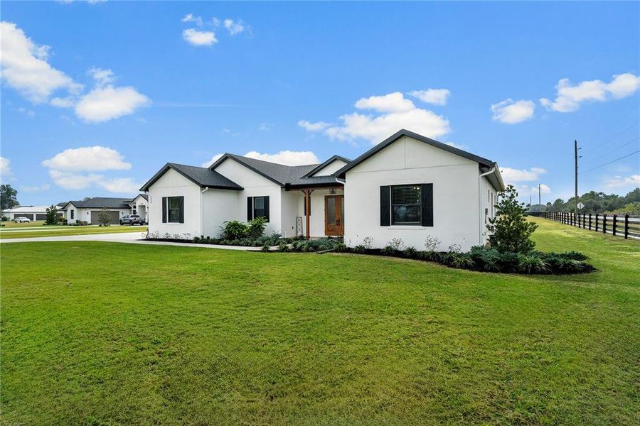 Front exterior of a new home in , Tavares, FL, highlighting curb appeal (Image 25).