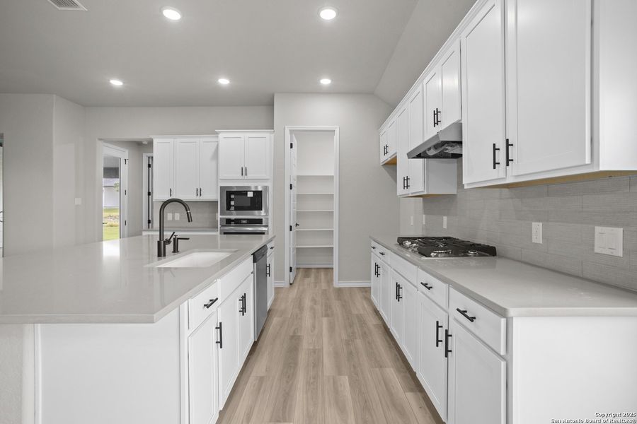 Furnished interior view inside a new home in Potranco Oaks, Castroville (Image 12).