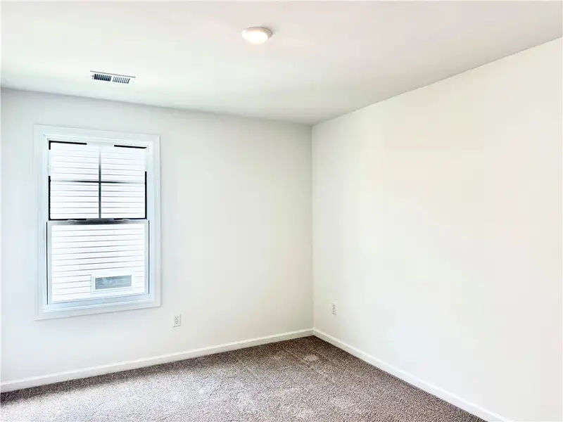 A window with built-in blinds invites natural ligh