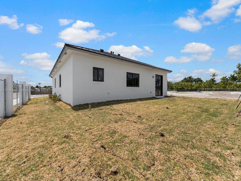 Front exterior of a new home in , Homestead, FL, highlighting curb appeal (Image 14).
