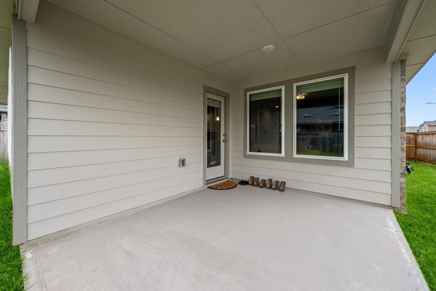 Exterior details and patio area of a home in Heights of Barbers Hill, Mont Belvieu (Image 3).