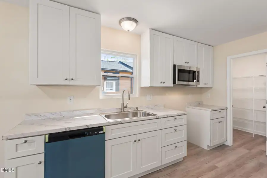 Kitchen view into pantry