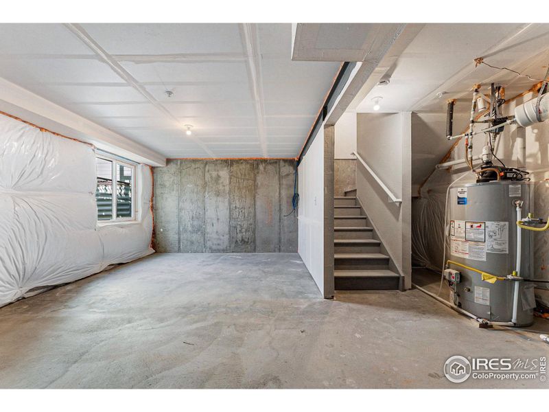 The unfinished garden-level basement gets a lot of light and is ready for your imagination