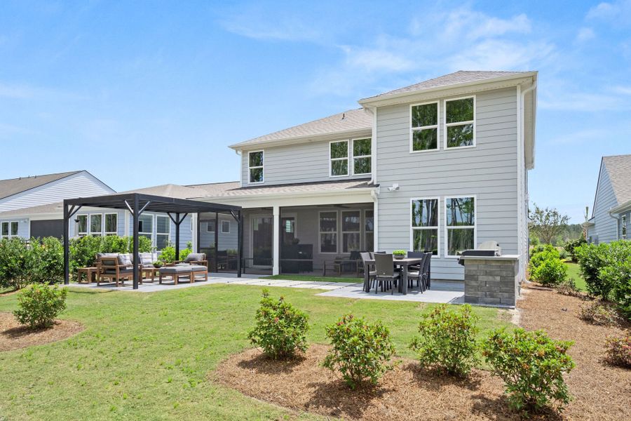 Exterior details and patio area of a home in Sun City Hilton Head, Bluffton (Image 31).