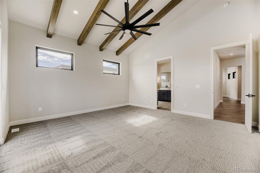 Primary suite with beamed ceiling