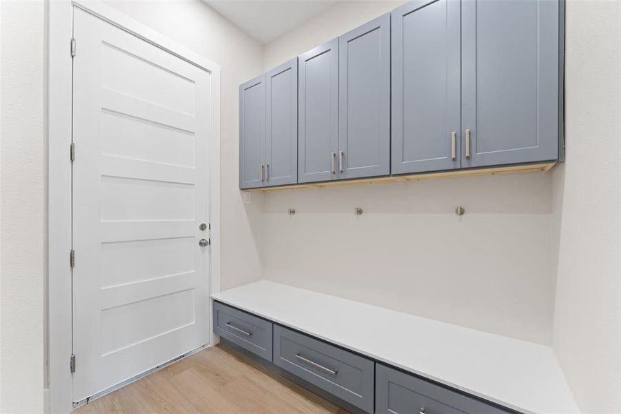 Mudroom featuring light wood finished floors Mudroom featuring light wood finished floors