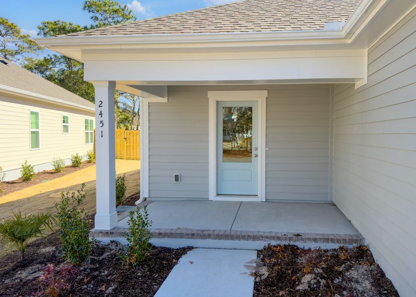 Exterior details and patio area of a home in Osprey Landing, Southport (Image 3).