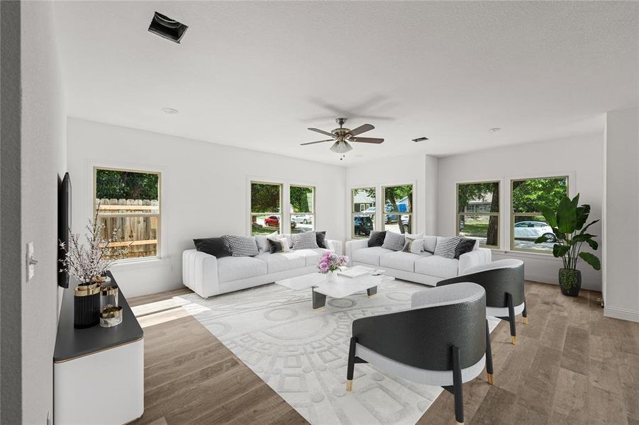 Living room with light wood-type flooring and ceiling fan