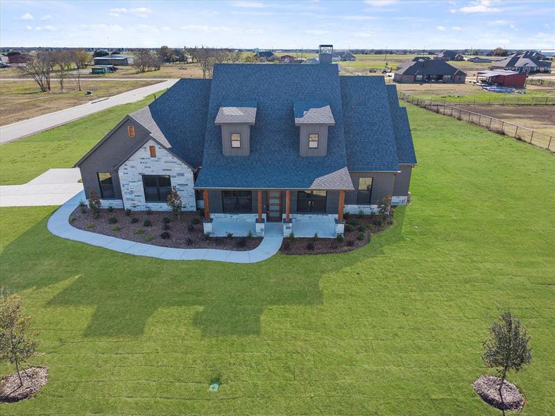 Front exterior of a new home in , Caddo Mills, TX, highlighting curb appeal (Image 7).