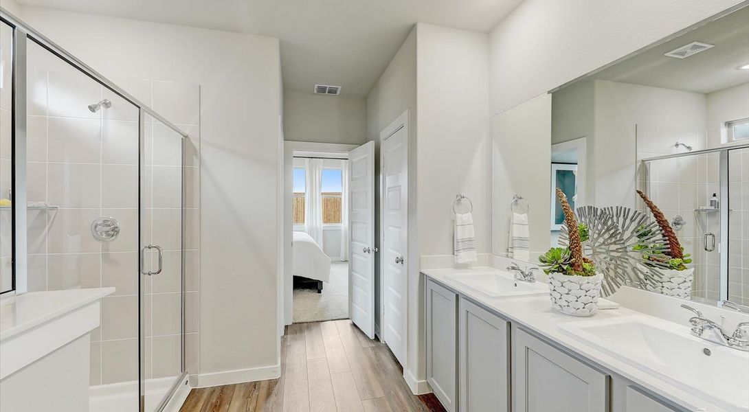 Primary bathroom sitting area in the Oak home plan by Trophy Signature Homes – REPRESENTATIVE PHOTO